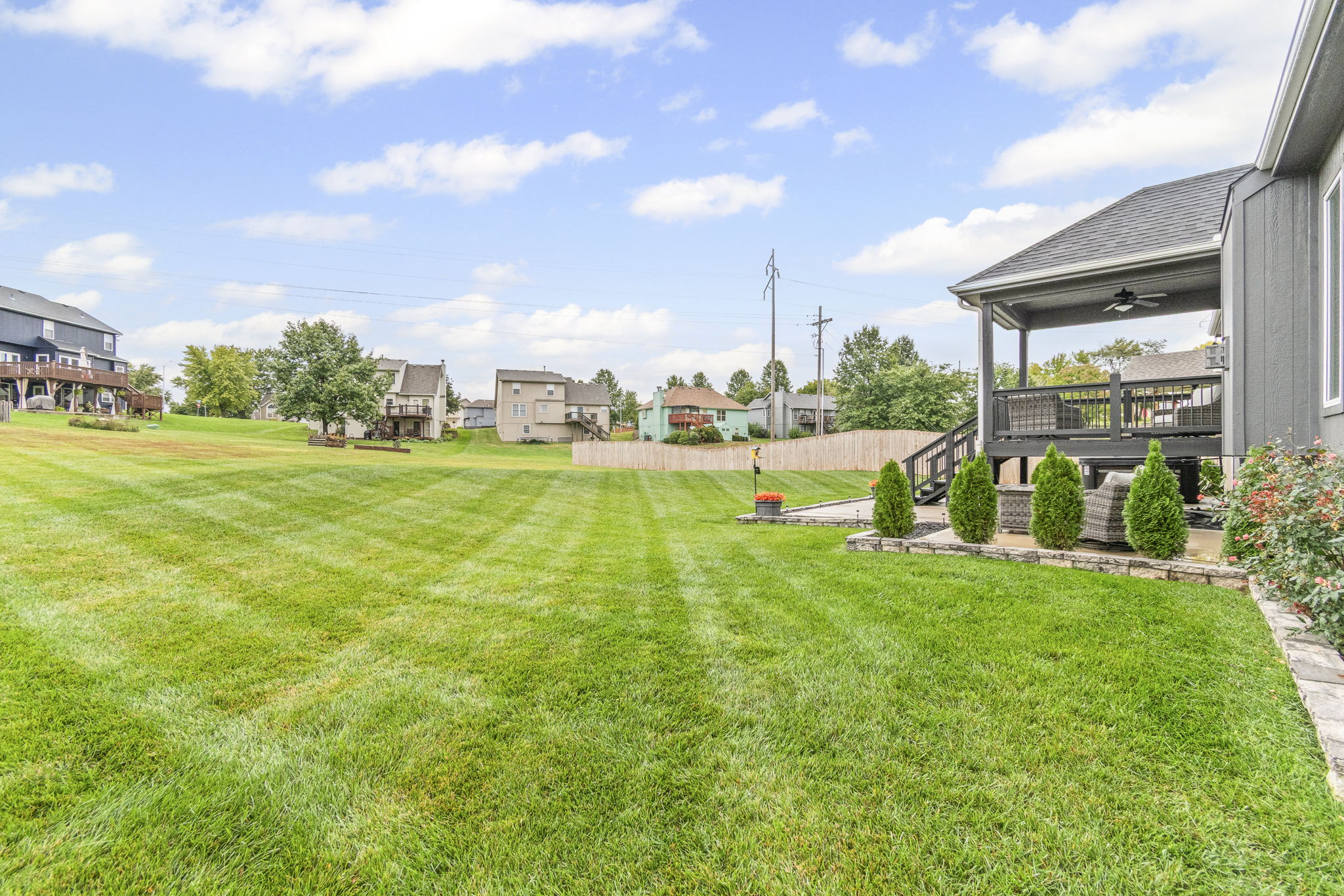 Covered deck and large yard backing to green space