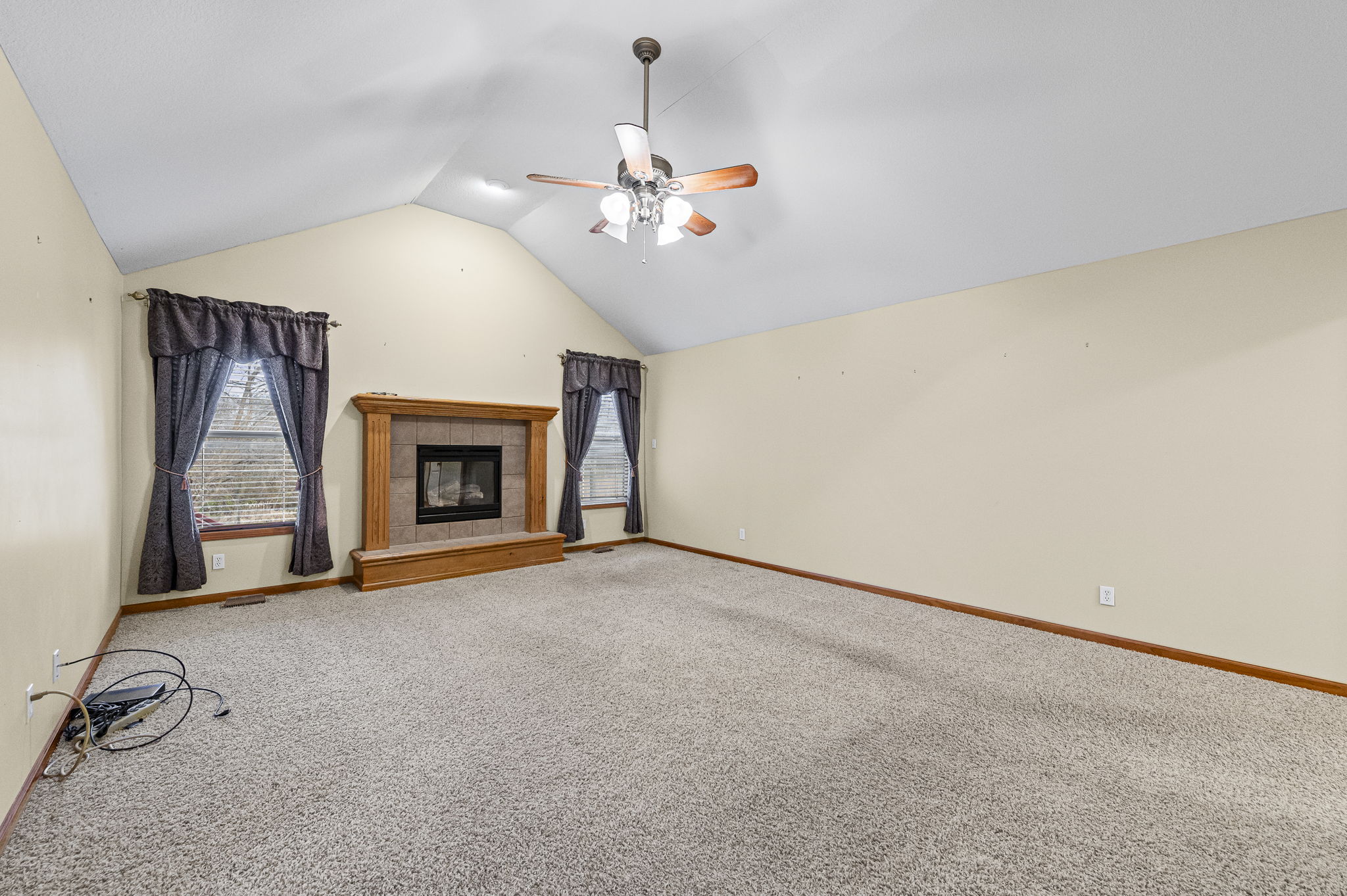 Vaulted living room with cozy fireplace