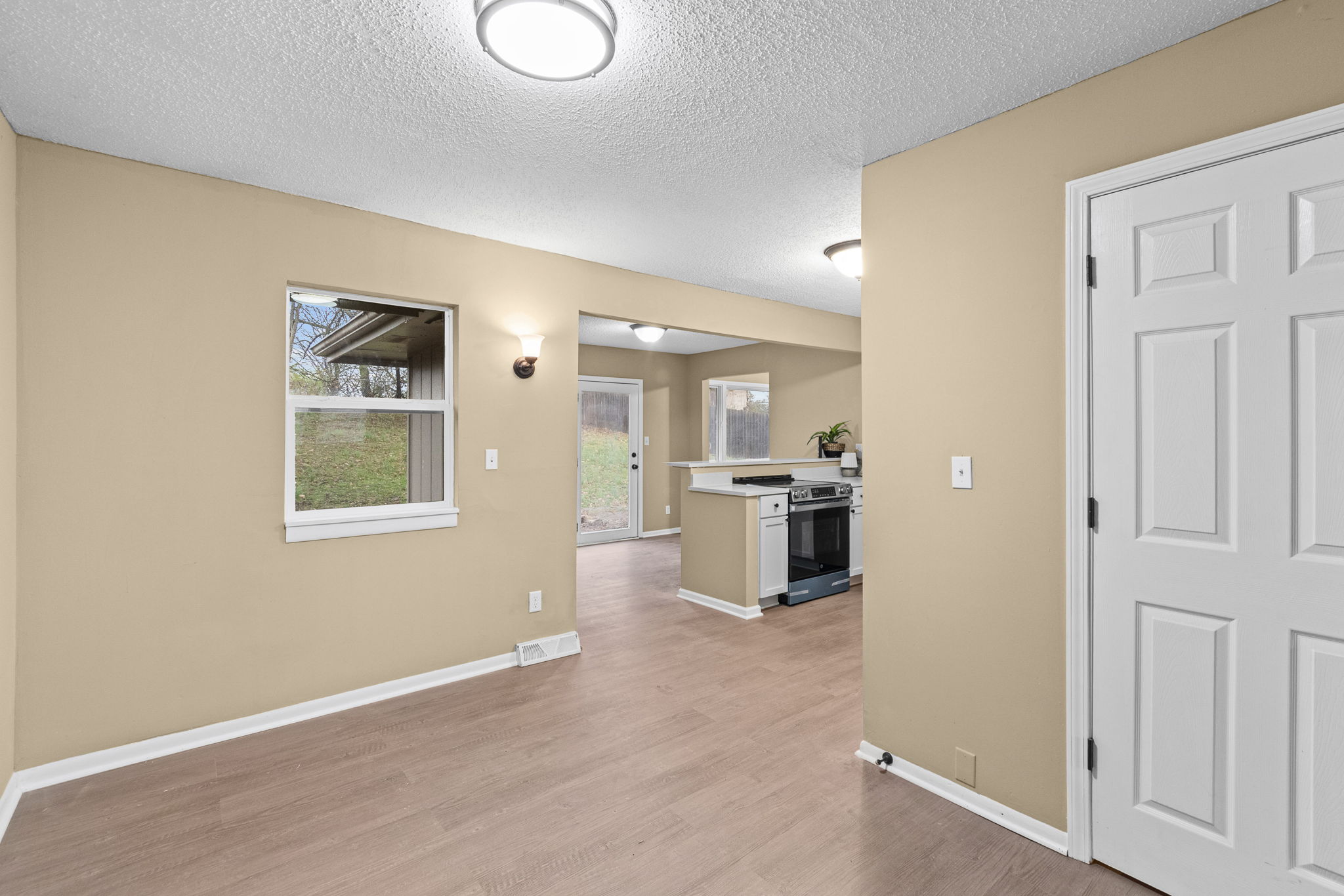 Open main level connecting living and kitchen