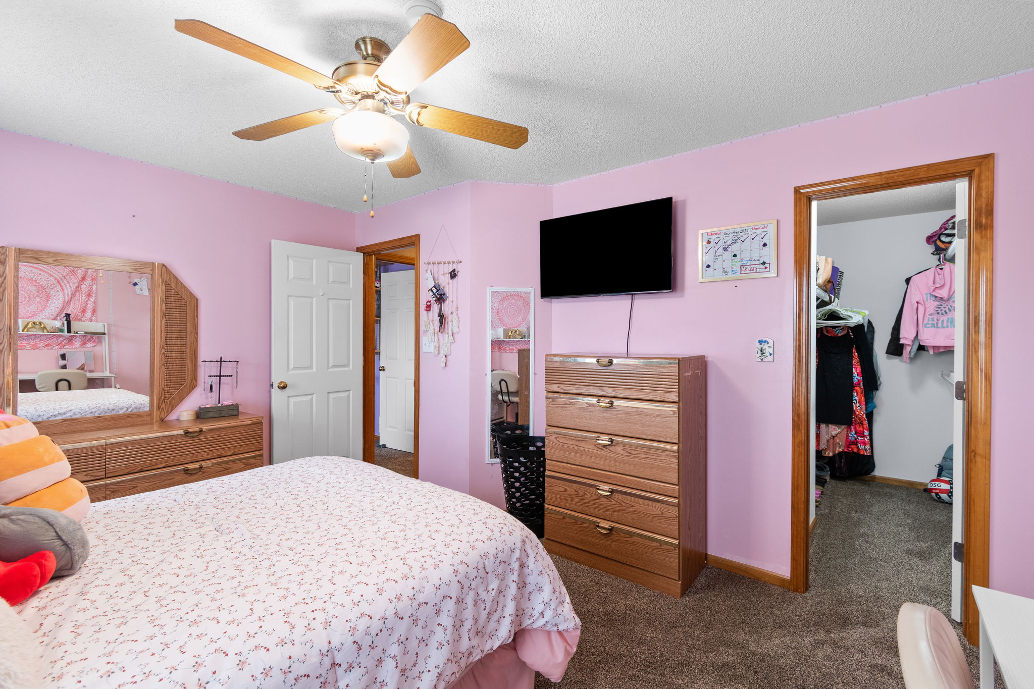 Flexible main-level suite — secondary living, bedroom, and full bath for multi-generational living