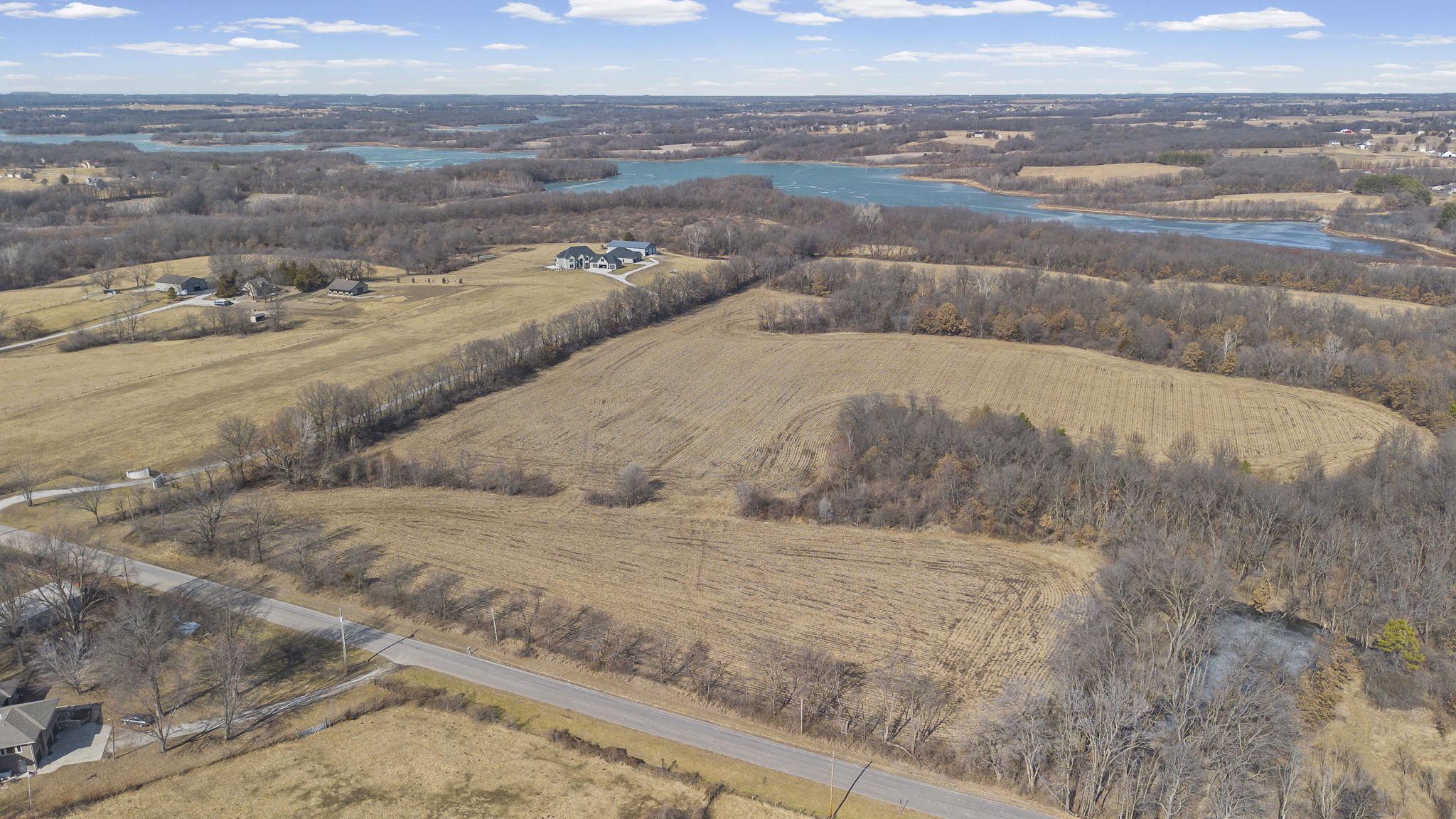 Aerial view of the full 26.3-acre parcel with Smithville Lake in the distance
