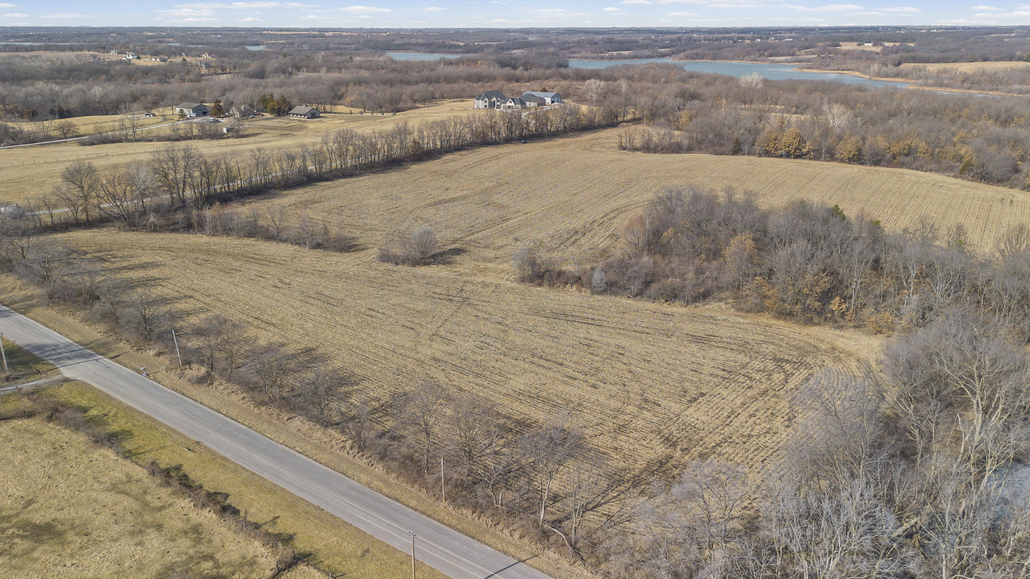 Wide view across the acreage toward the lake
