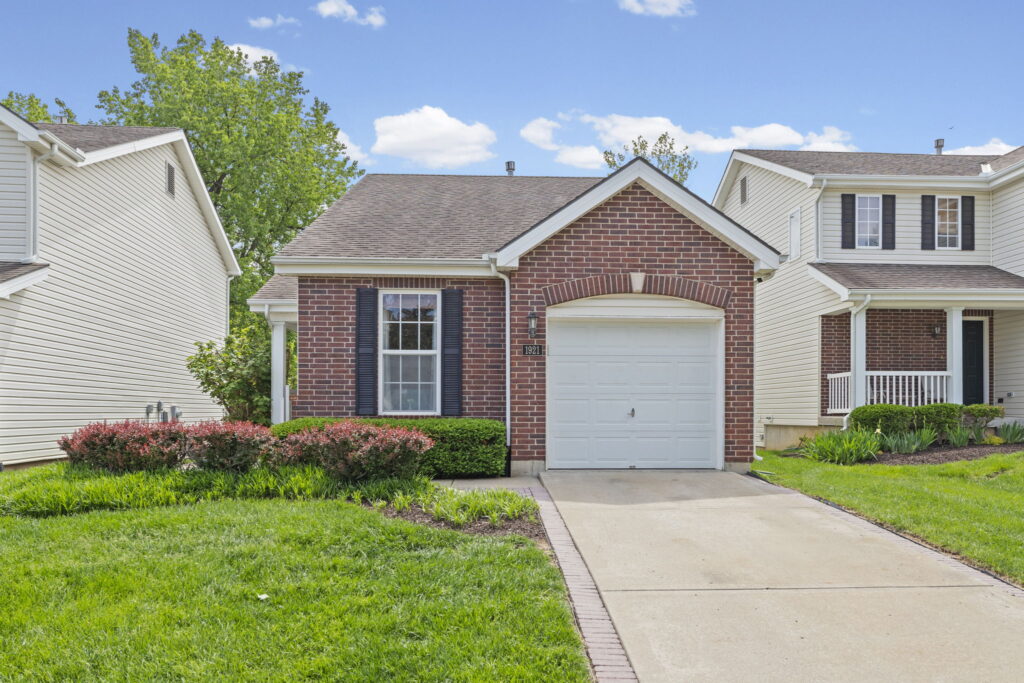 Brick-and-vinyl ranch home at 1921 NW 82nd Street in Timber Hills, Kansas City