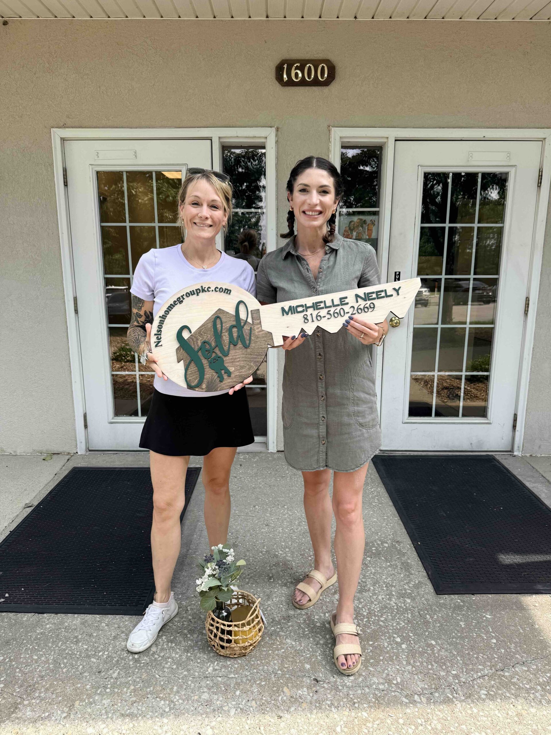 Michelle Neely with our buyer at closing on 608 Foxglove Lane