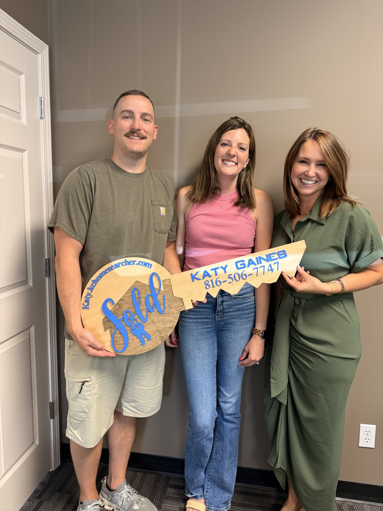 The Zachariah family at closing with Katy Gaines of Nelson Home Group