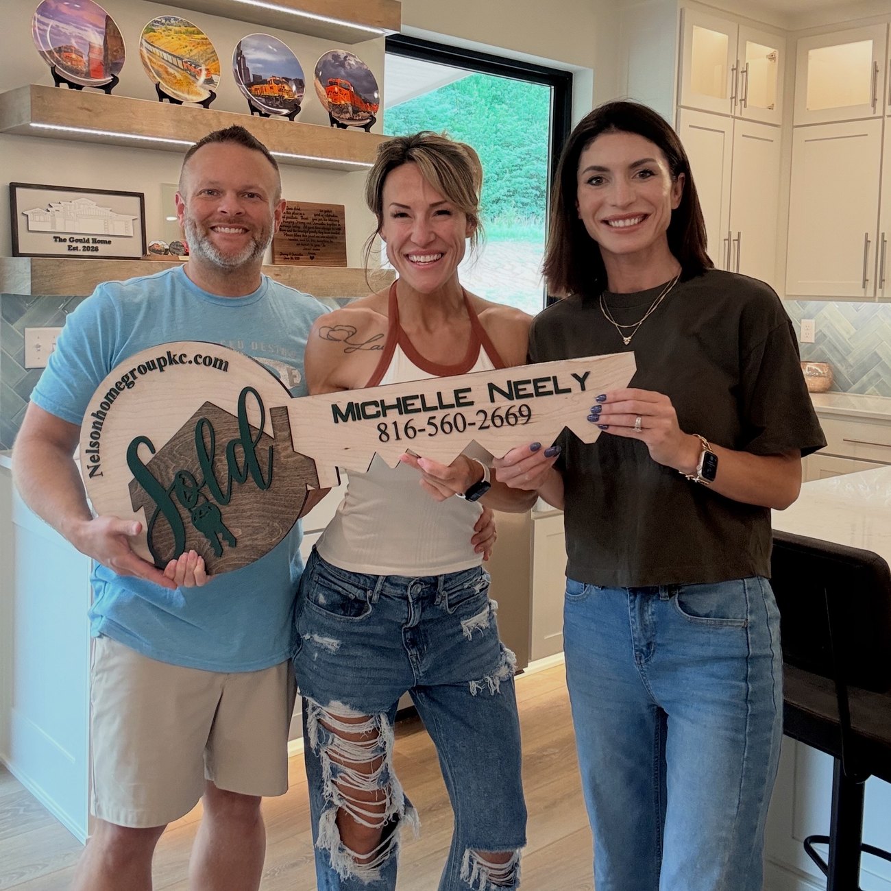 Sam and Jeremy Gould at closing with Nelson Home Group agent Michelle Neely