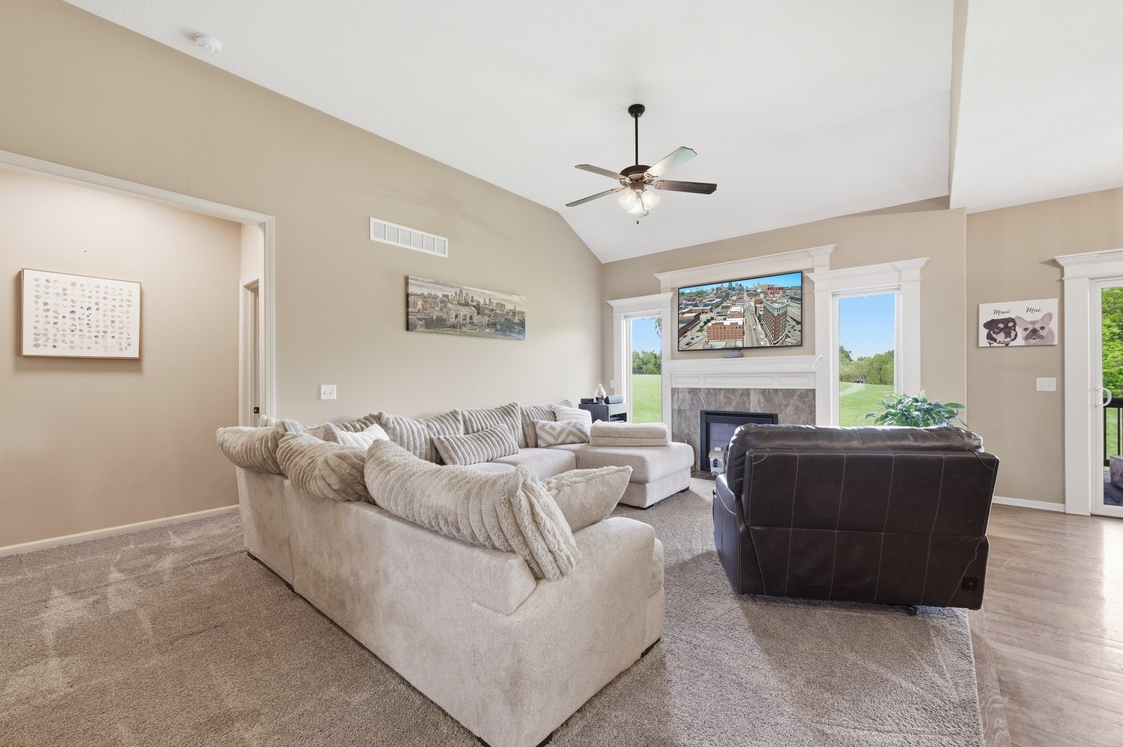 Open living room with central fireplace at 201 S MariMack Drive, Kearney