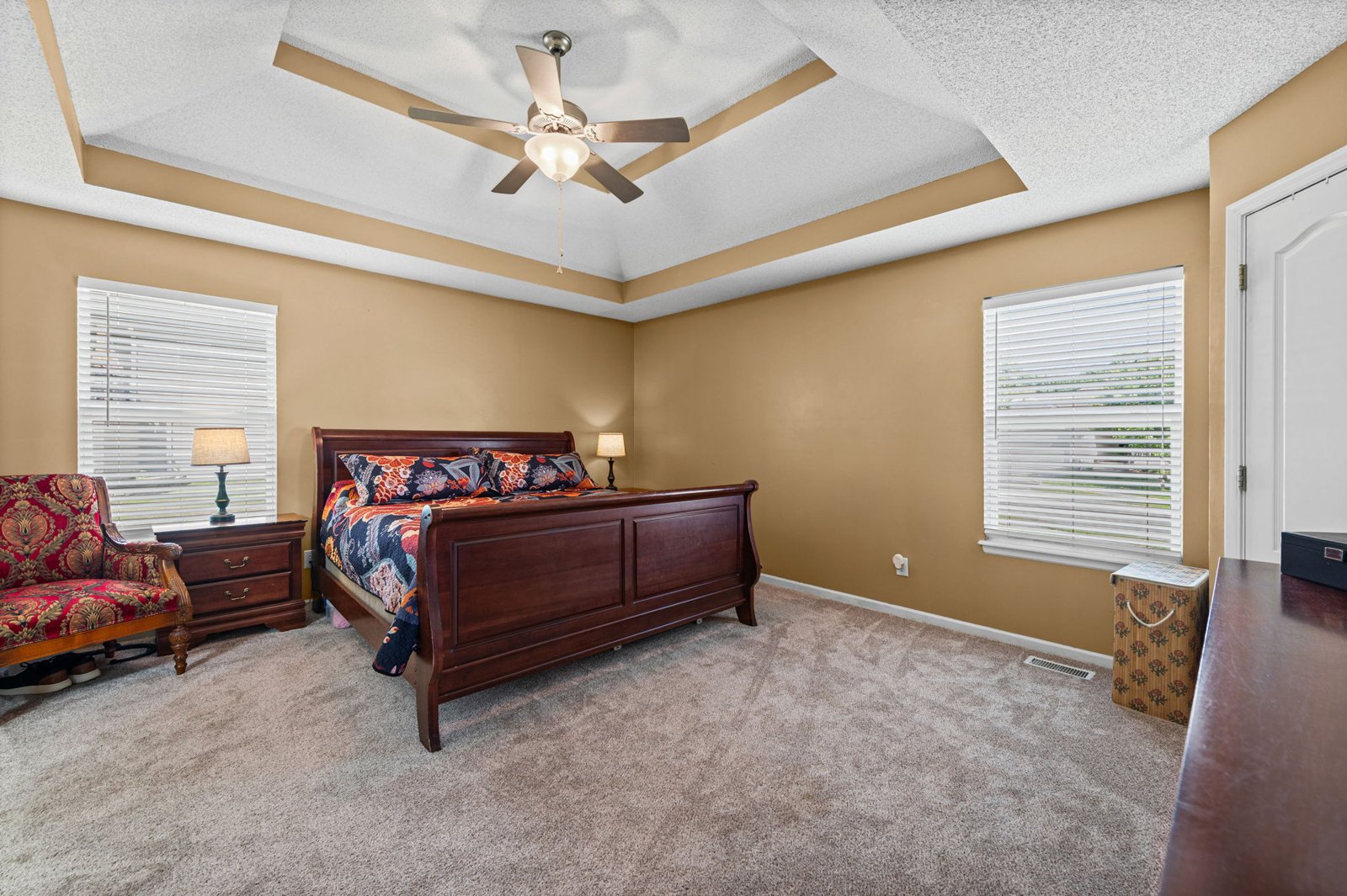 Primary bedroom with tray ceiling
