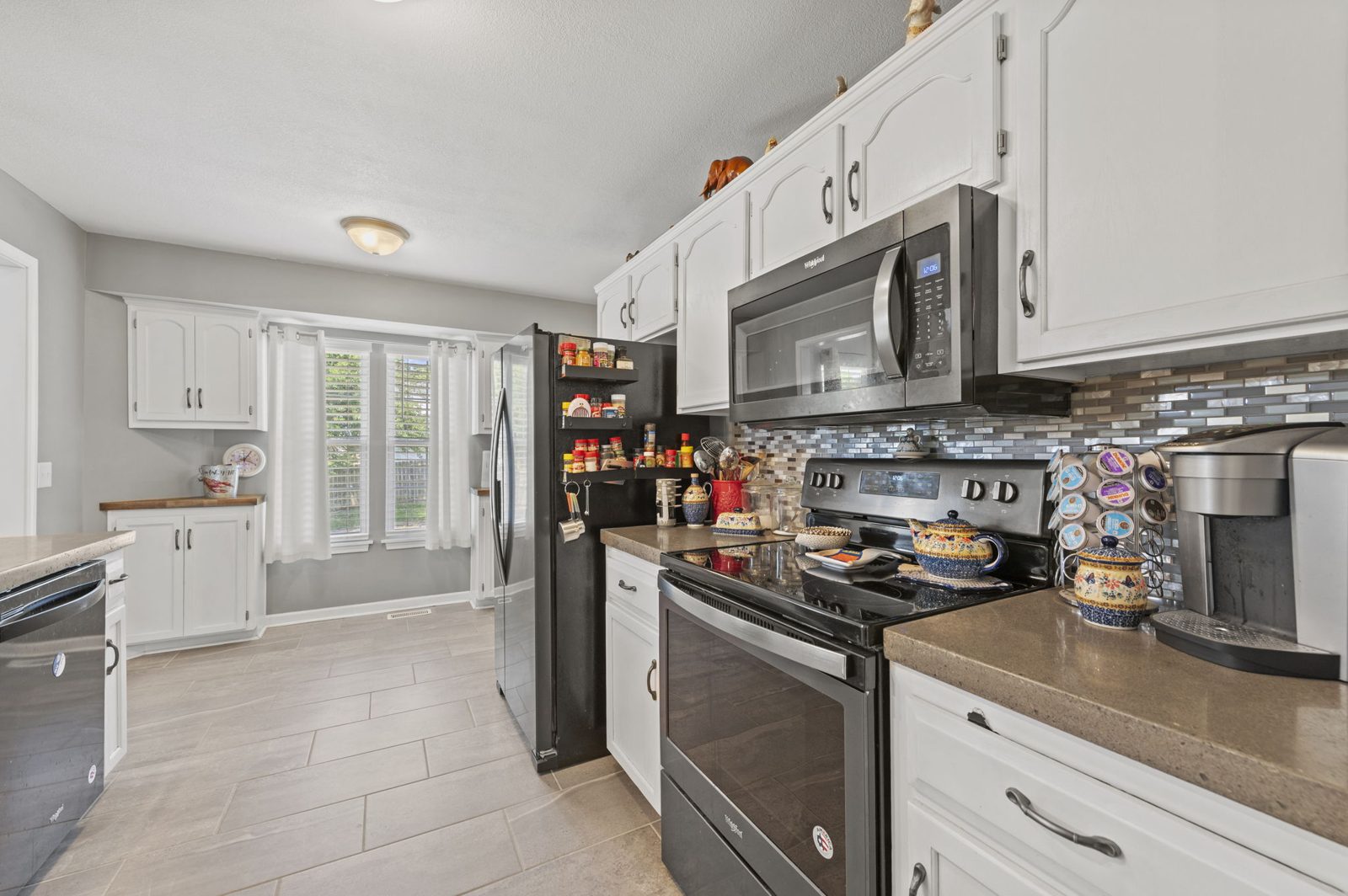 Kitchen with range and tile backsplash at 1700 Todd Street
