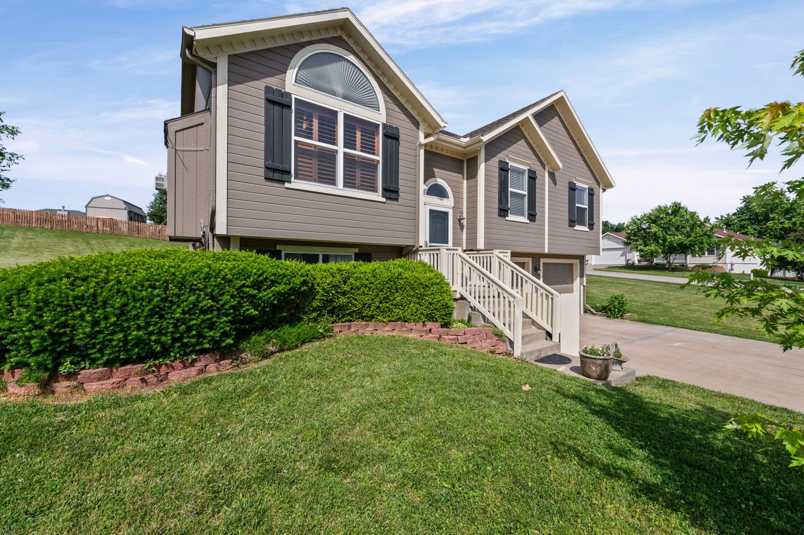 Front exterior of 1700 Debrah Drive on its landscaped corner lot