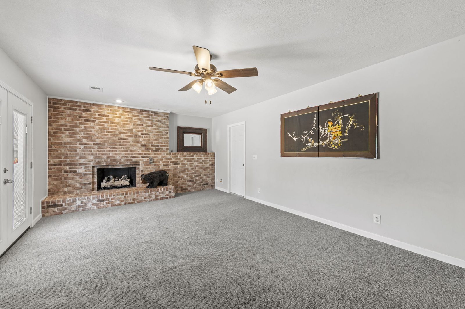 Lower-level living space with fireplace at 1700 Todd Street