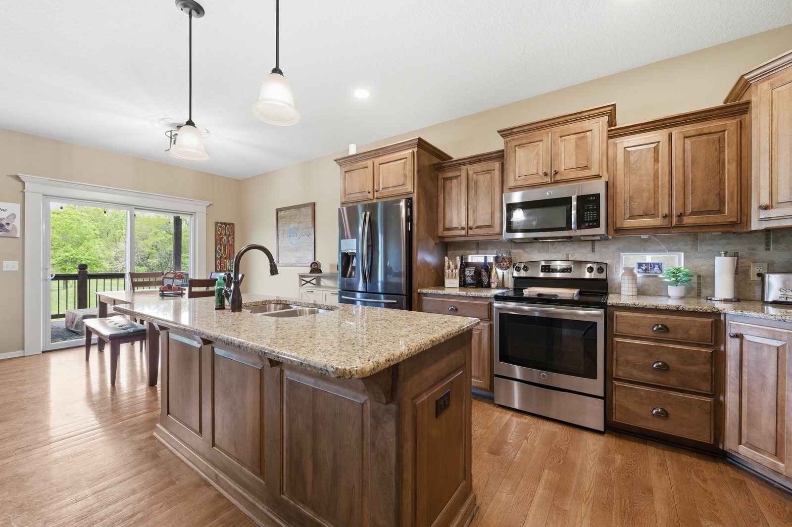 Kitchen with stainless appliances and breakfast bar