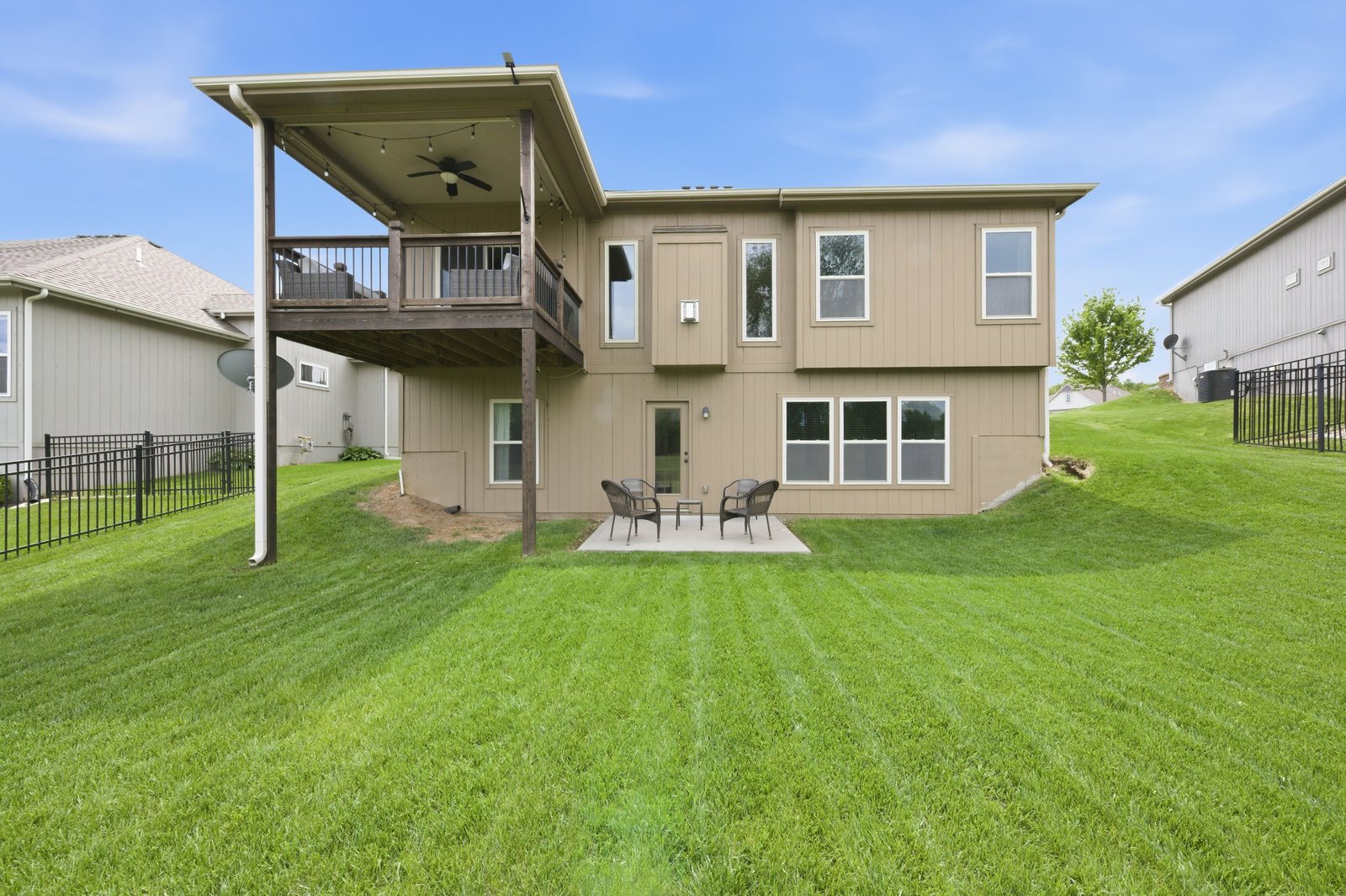 Rear exterior with walk-out lower level backing to the MariMack golf course